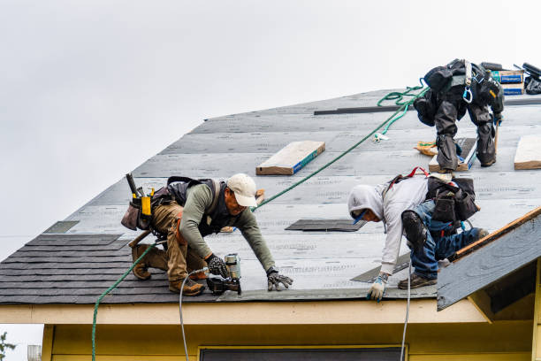 Professional Roofing technician working in Aston, PA